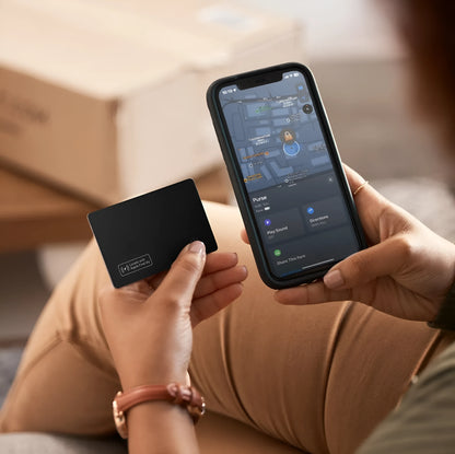 Black ultra-thin anti-loss alarm card for Apple devices, shown next to a credit card for size comparison.