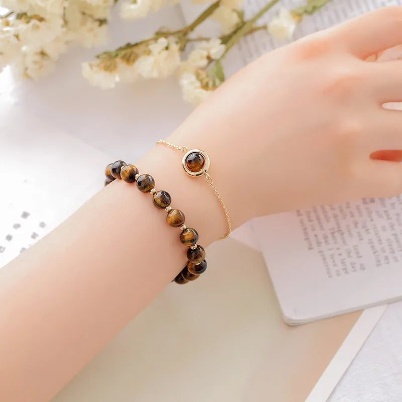 Double-layer women's bracelet with lucky beads and colourful crystals in gold-toned setting