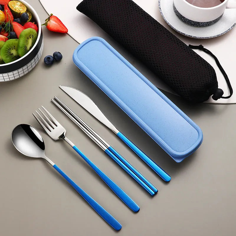Gold and black stainless steel knife fork spoon set inside a grey mesh carrying bag.