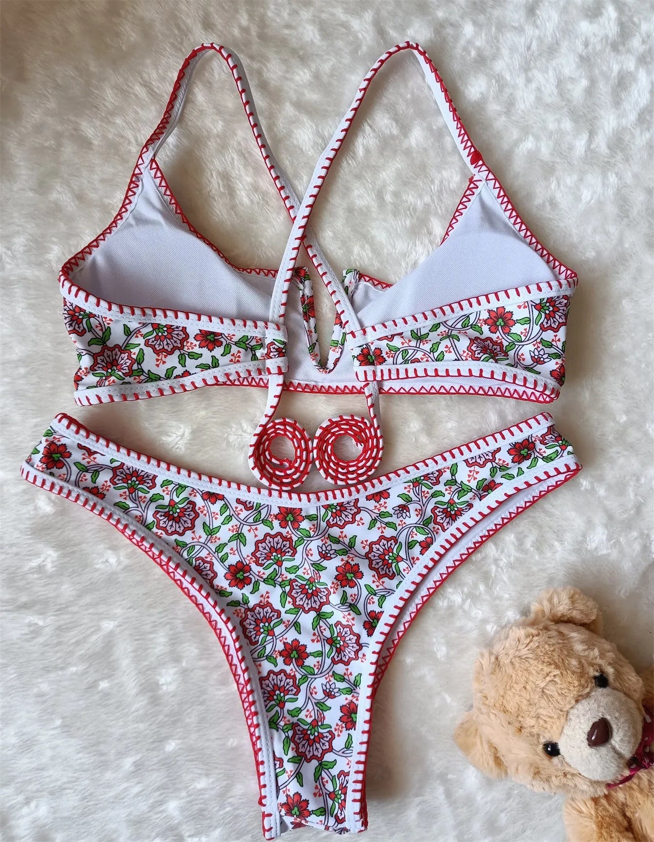 Women's floral embroidered V-neck bikini swimsuit on a mannequin