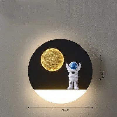 Astronaut-shaped wall lamp with small shelf in black or white finish for bedside placement