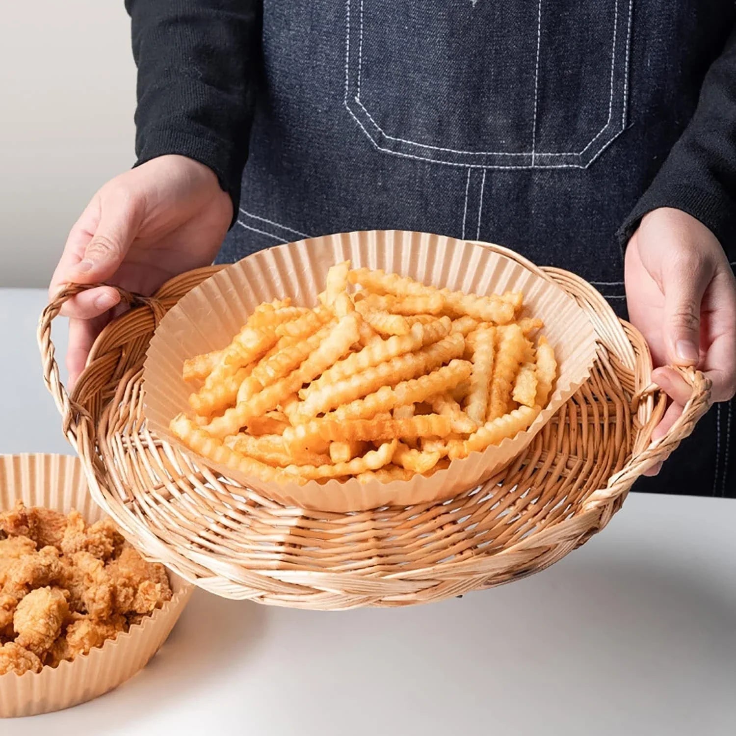 Disposable air fryer liners made from high-quality parchment paper, designed to keep your air fryer clean and your meals healthy