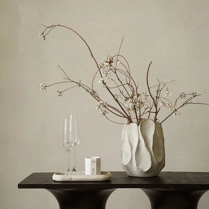Hand-formed irregular ceramic vase measuring 25cm tall with 15cm diameter opening, made from magnesium clay