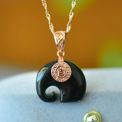 Copper inlaid pendant with natural grey Hetian jade and dark ink blue jade on a necklace.