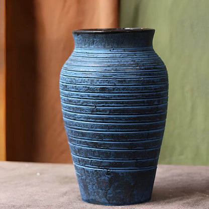 Ceramic mosaic vase with dried flower arrangement, handcrafted surface detailing