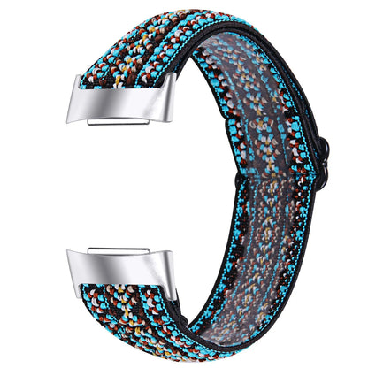 Printed elastic watch strap compatible with Fitbit Charge 6 shown in adjustable position
