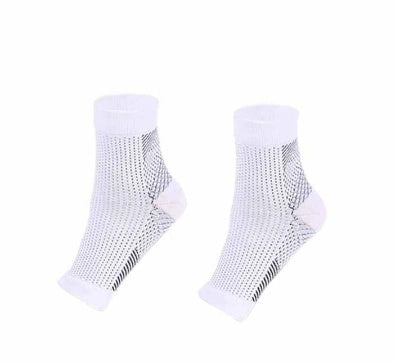 Anti-fatigue compression foot sleeve in black, red, or white, featuring moisture-wicking fabric and a heel hole for breathability.