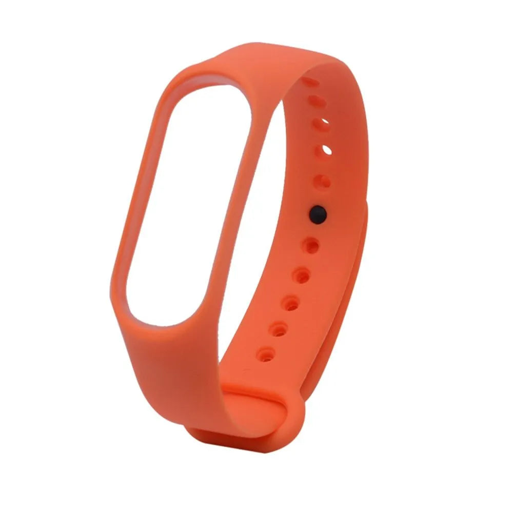 Colourful silicone replacement strap for XIAOMI MI Band 3 smart watch on a wrist.
