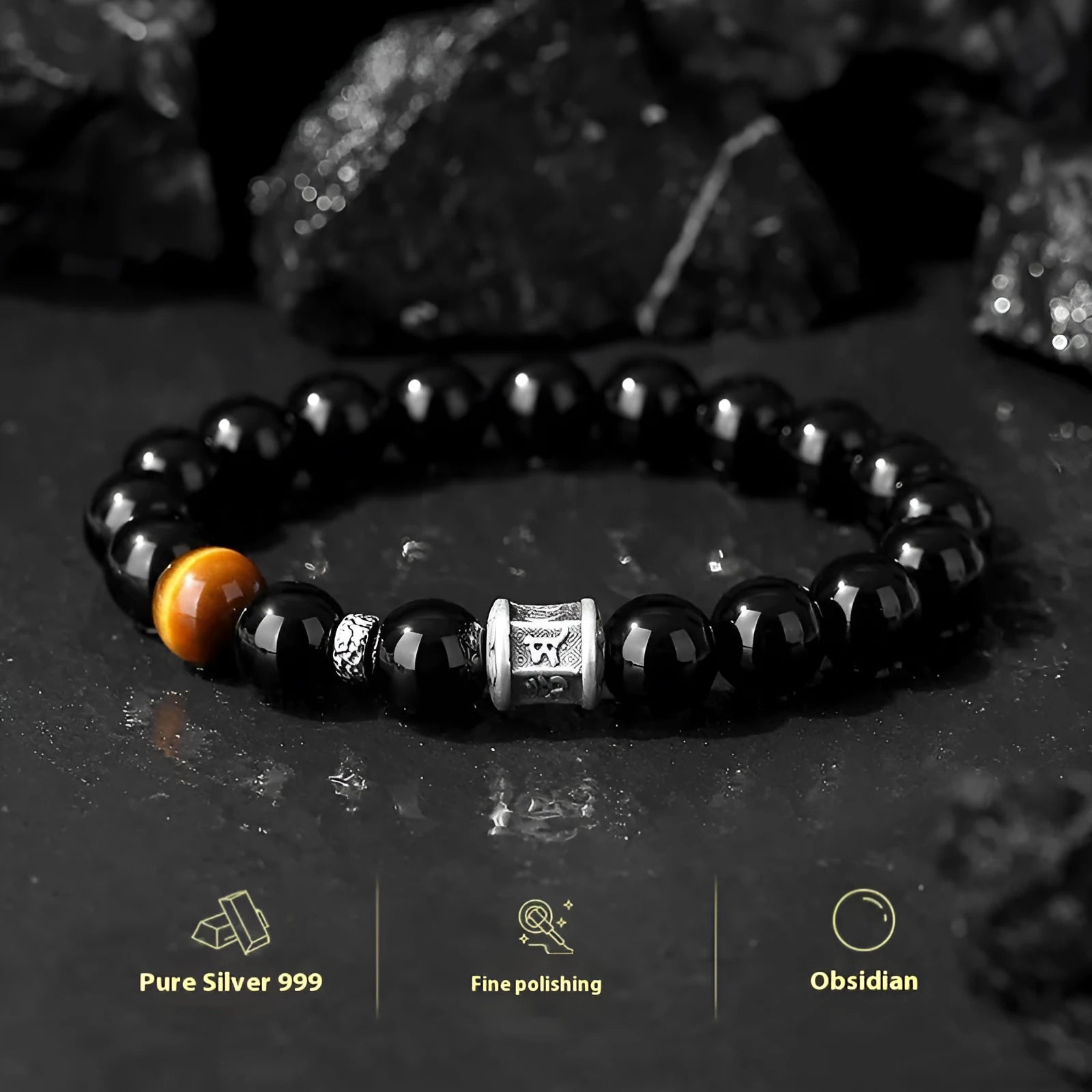 Men's black obsidian bracelet with 10mm prayer wheel beads and silver accents showing hand-woven construction