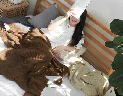 Fringed knitting blanket in beige colour showing 5cm fringe detailing and dense acrylic weave texture