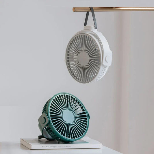Portable USB desk fan with 360-degree rotation, multiple wind speeds, and long-lasting battery life