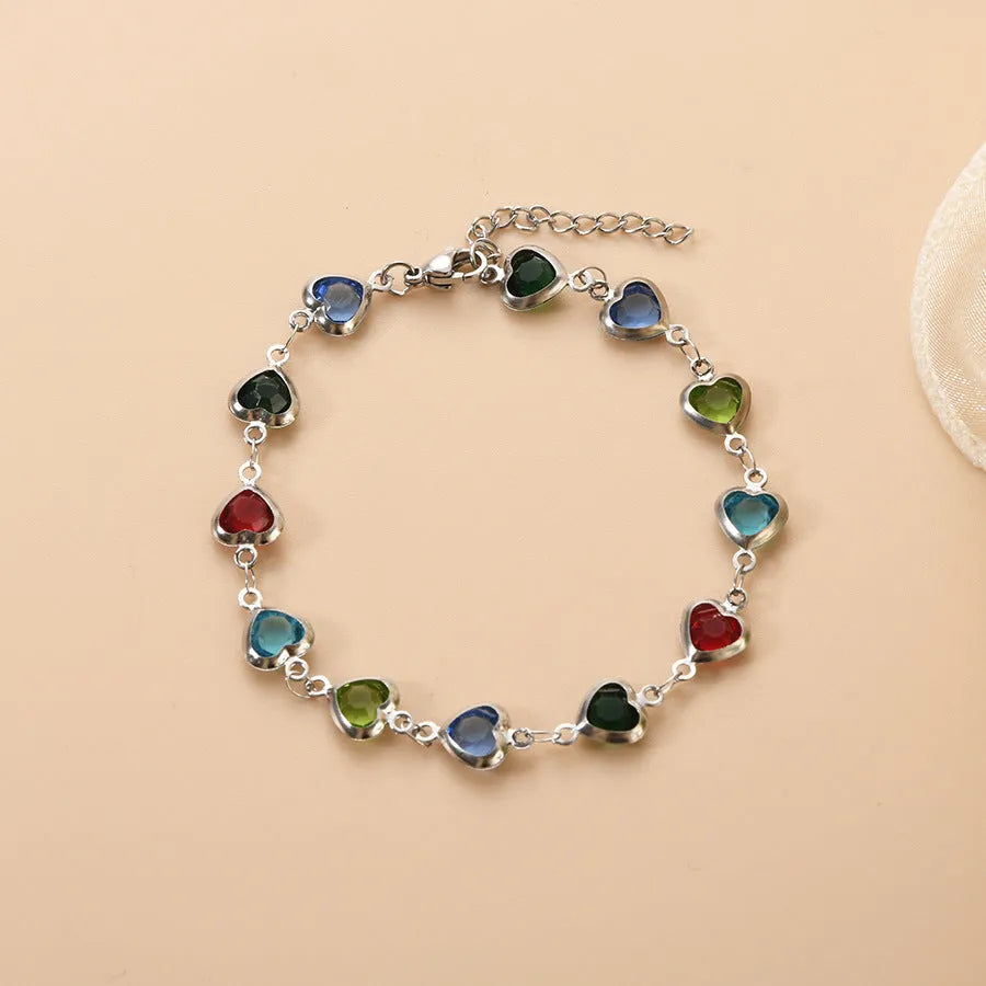 Devil's eye geometric heart bracelet in stainless steel showing colourful electroplated finish options.