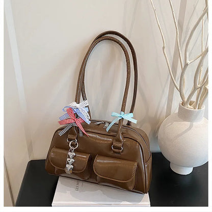 Women's retro pillow-shaped handbag in PU leather with double shoulder straps and flap closure
