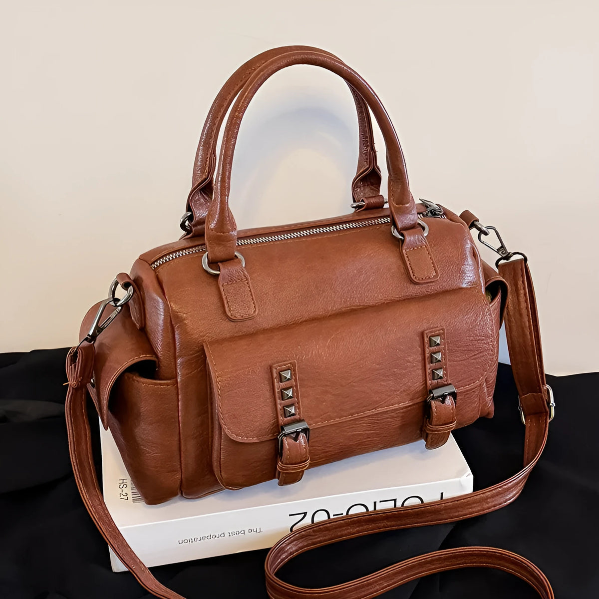 Vintage style messenger bag in PU leather with contrast stitching, horizontal square shape, shown in multiple colour options