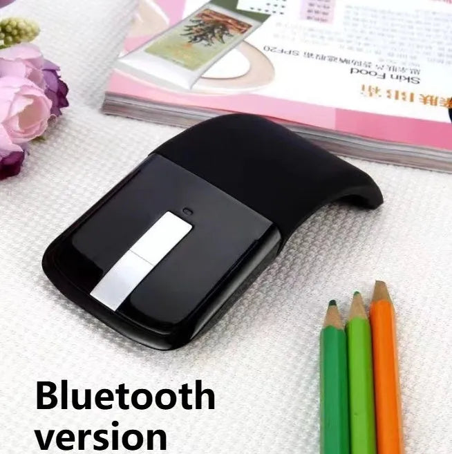Folding wireless touch mouse showing compact design with Bluetooth connectivity
