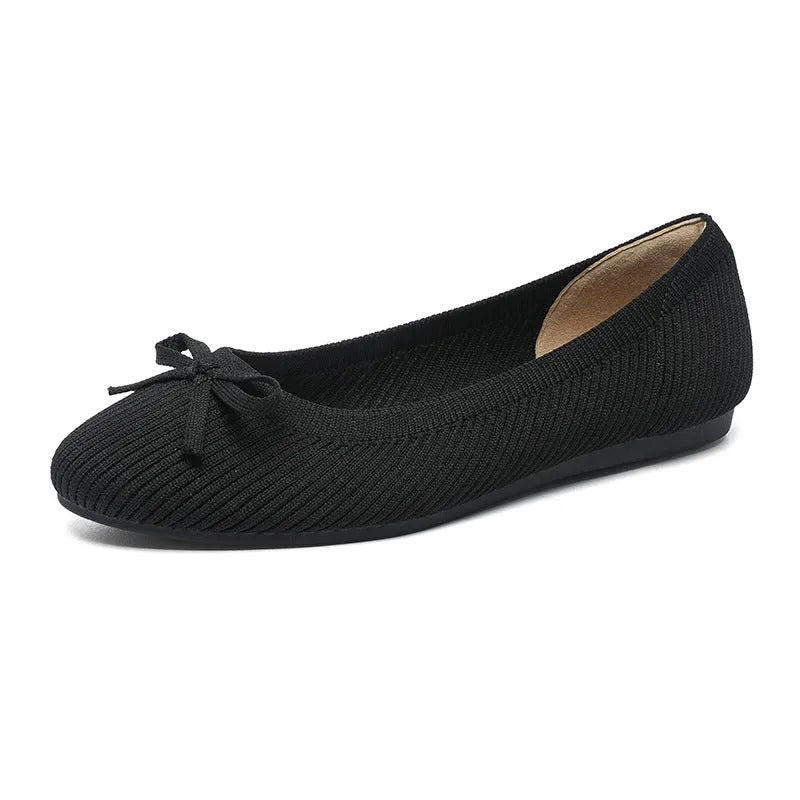 Women's round toe flat pumps with bow detail in butterfly colours showing fabric upper and shallow mouth opening