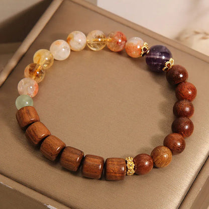 Women's crystal bracelet with yellow tower crystal, ebony amethyst beads, pearl and rhinestone decoration