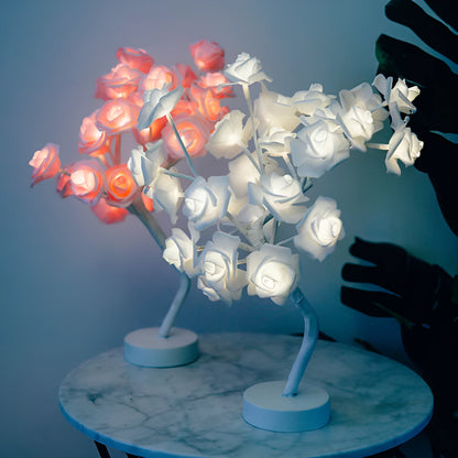 White and red rose flower LED lamp on a table with bonsai tree shape and warm white glow.
