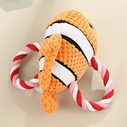 Grey turtle-shaped plush dog toy with a knotted rope chew core visible.