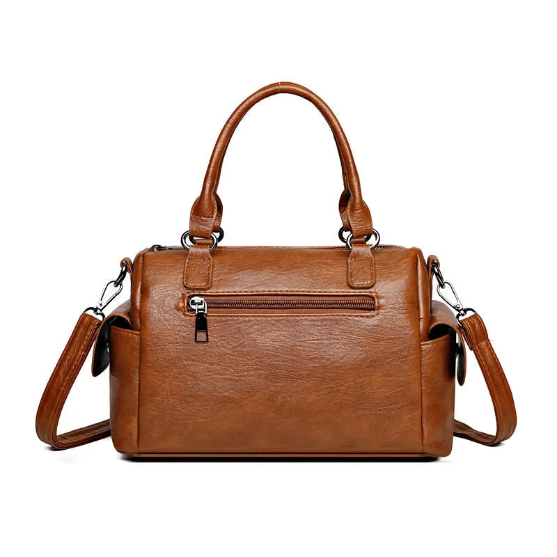 Vintage style messenger bag in PU leather with contrast stitching, horizontal square shape, shown in multiple colour options