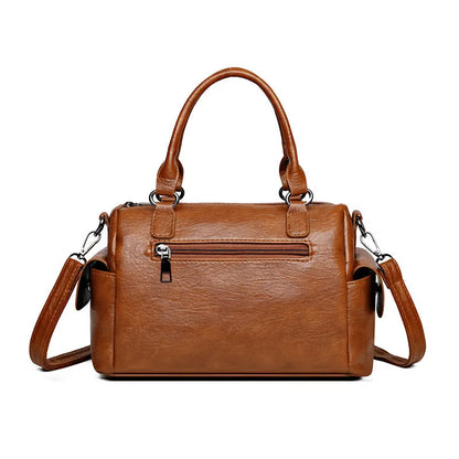 Vintage style messenger bag in PU leather with contrast stitching, horizontal square shape, shown in multiple colour options