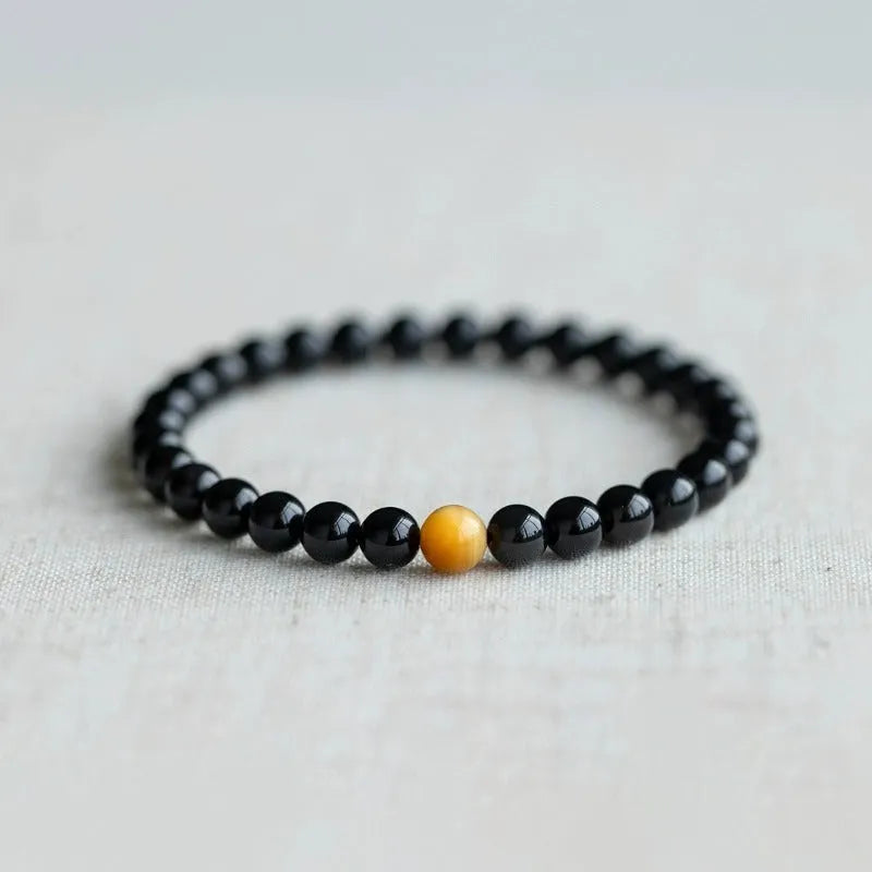 Black obsidian stone bracelet with geometric beads in unisex Korean style.