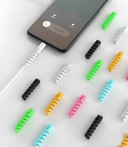 Plastic charging cable protector sleeve shown in various colours including black, blue, pink and yellow.