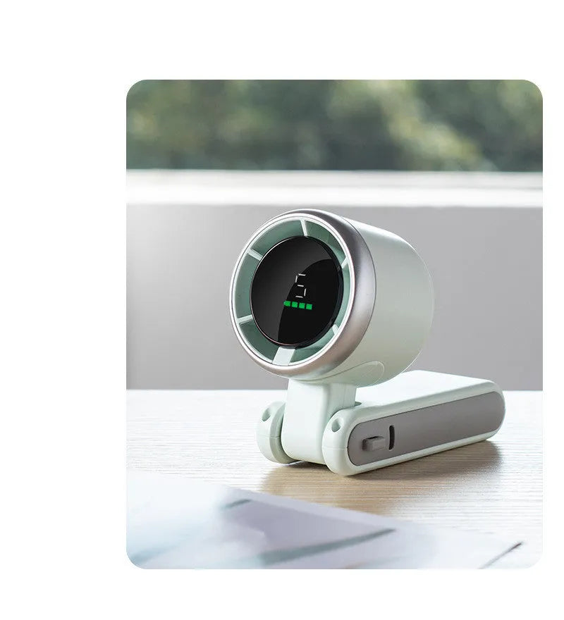 Portable folding mini fan showing adjustable head and compact plastic housing with USB Type-C charging port
