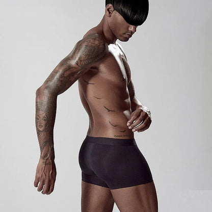 Men's solid colour seamless modal underwear in mid-waist style on a white background.