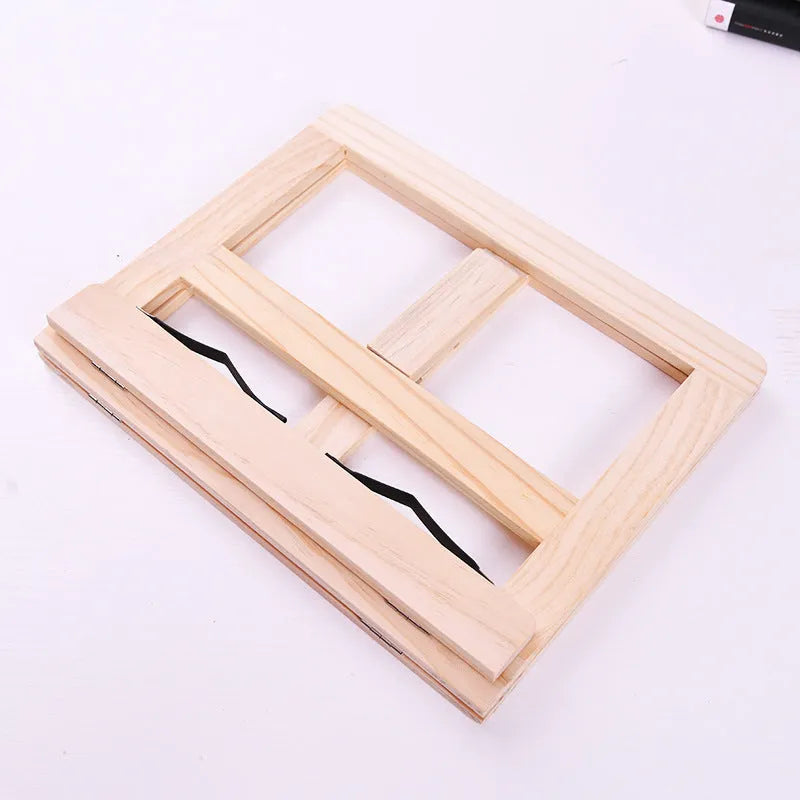 Large wooden reading book easel in pine with iron clamp, 31x24 cm, holding an open book on a desk