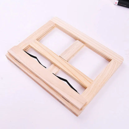 Large wooden reading book easel in pine with iron clamp, 31x24 cm, holding an open book on a desk