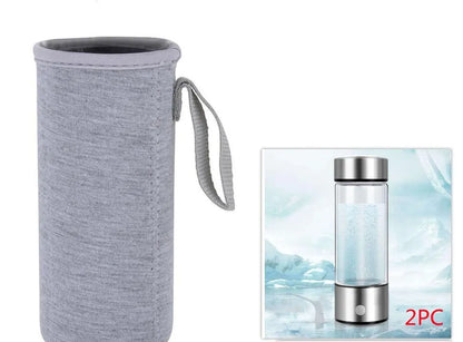 Portable hydrogen water bottle with glass chamber and stainless steel components showing electrolysis bubbles