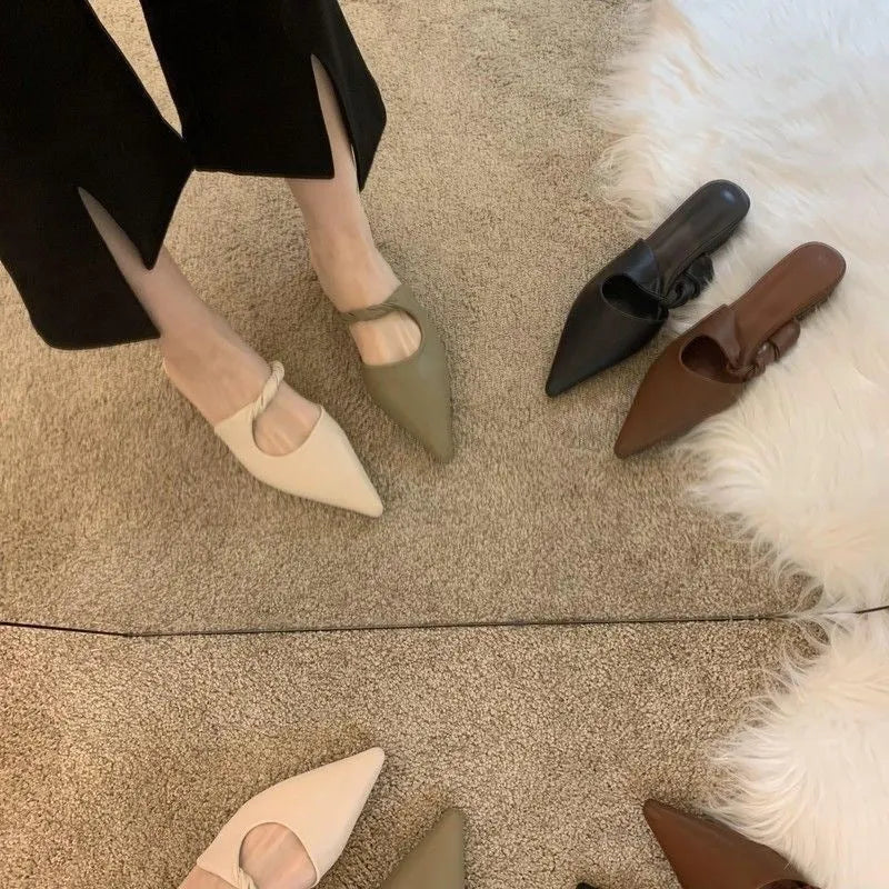 Women's soft leather-lined semi-toe box slippers in neutral colours on a rubber sole.
