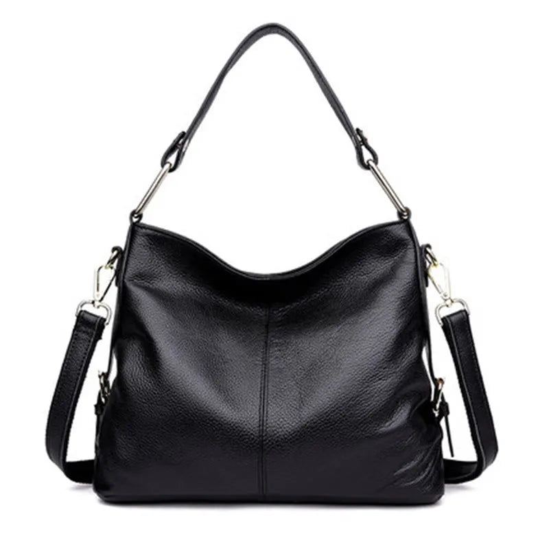 Black genuine leather vertical crossbody bag with multiple internal compartments and a sandwich pocket.