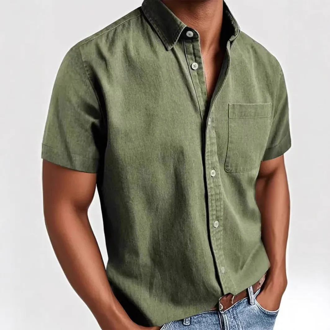 Man wearing a grey loose-fit short sleeve cardigan style shirt