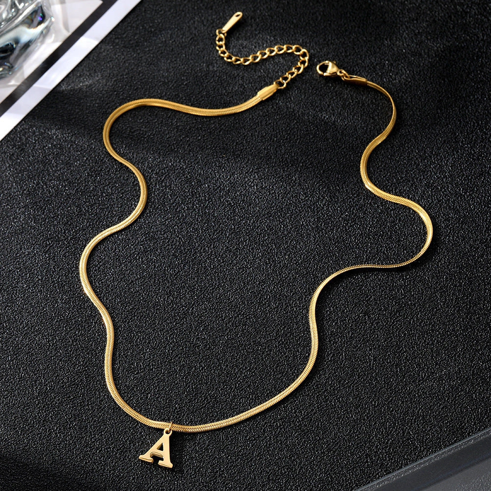 Elegant gold A-Z letter pendant necklace on a snake chain