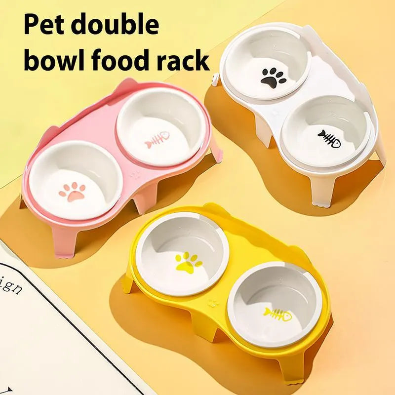 Ceramic cat food and water bowl set in elevated tilted stand, shown in blue, pink, white, and yellow colour options.