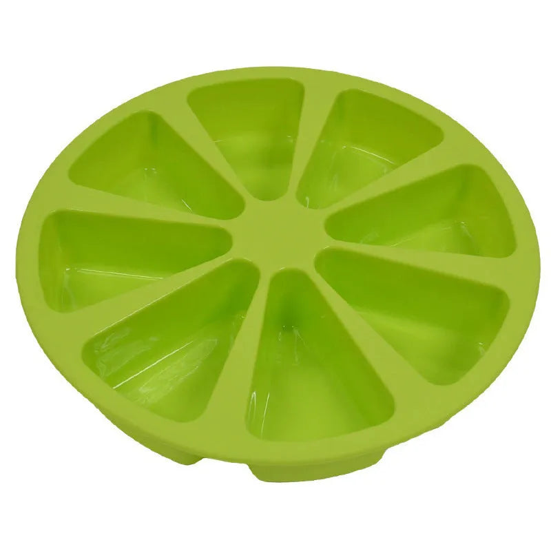 Green silicone cake mould measuring 7 by 4.5 centimetres on a baking tray.