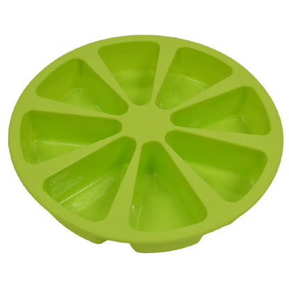 Green silicone cake mould measuring 7 by 4.5 centimetres on a baking tray.
