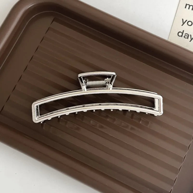 Silver metal hair claw barrette example from a range of 44 Korean-style designs.
