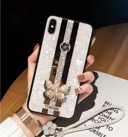 Decorative acrylic iPhone case featuring a diamond butterfly design with a mirror, shown in rose colour.