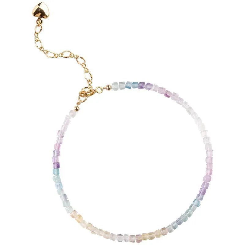 Handmade women's bracelet with rainbow fluorite stone in geometric copper links.