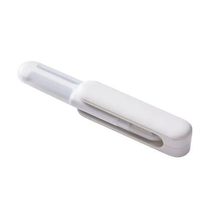 White multifunctional rotary kitchen peeler with stainless steel blade and ergonomic PP handle.
