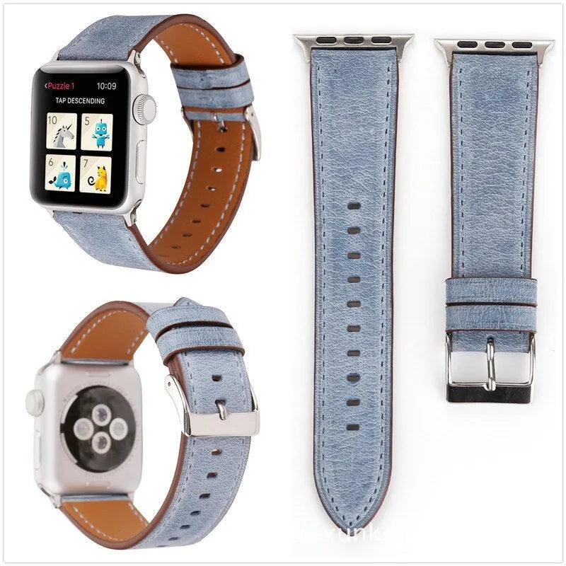 Leather watch strap with a folding buckle in blue, shown next to brown, green, orange, pink, and yellow colour options.