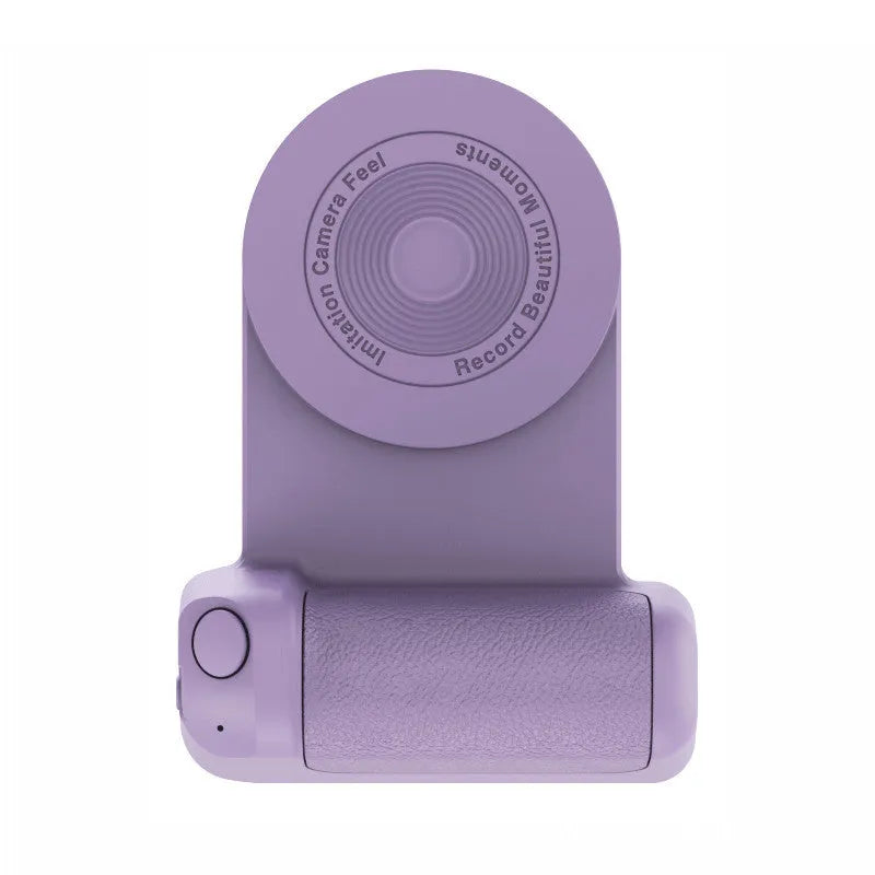 Black magnetic phone camera grip with rotatable bracket and ergonomic PU leather handle on a table.