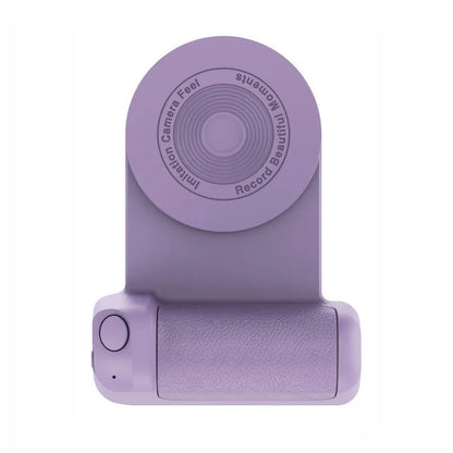 Black magnetic phone camera grip with rotatable bracket and ergonomic PU leather handle on a table.