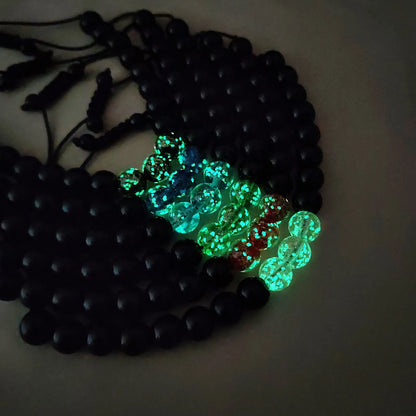 Adjustable luminous beaded bracelet with geometric glass beads on a stretchy elastic band in sapphire blue