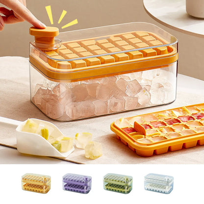 Green one-button press ice mould box with storage lid and ice shovel on kitchen counter