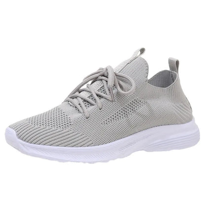 Women's Flyknit mesh running shoes in milky white with a low flat heel and rubber sole