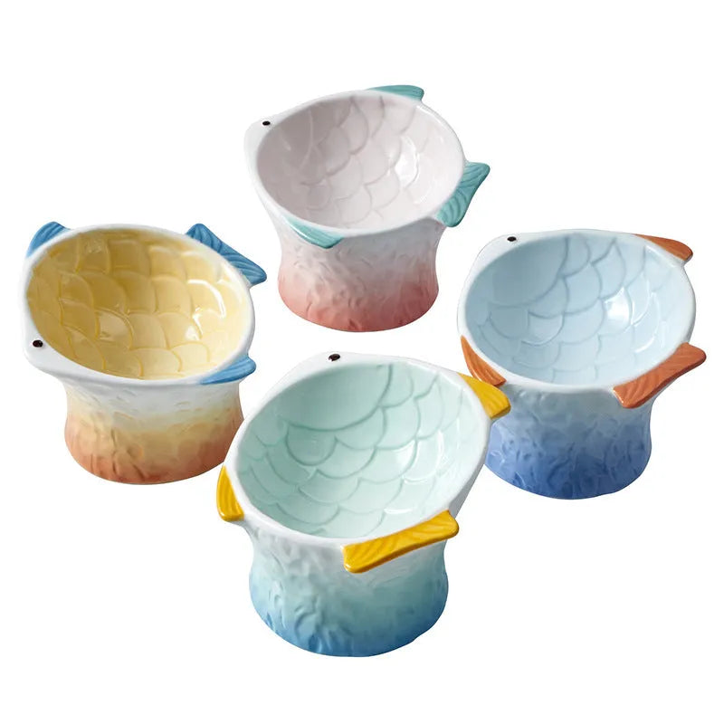 Fish-shaped ceramic cat feeder with 15-degree tilt to reduce neck strain and whisker fatigue, featuring a 120ml capacity and non-slip base for stable, mess-free meals.